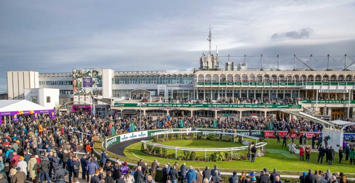 The crowds at a racecourse.