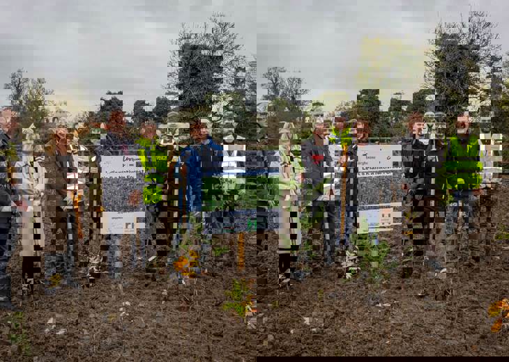Levy Ireland and Fairyhouse Racecourse employees standing with shovels as part of the forest planting scheme.