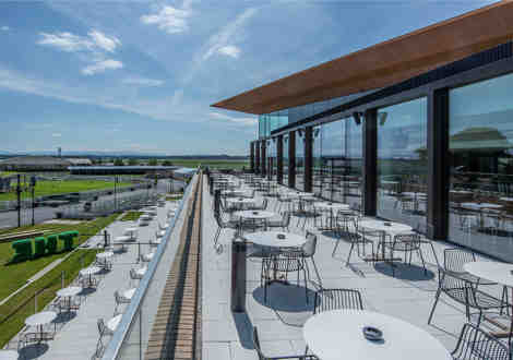 A rooftop patio dining area at The Curragh.